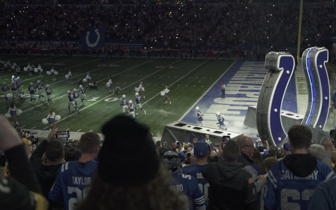 Colts players running through horse shoe at start of game